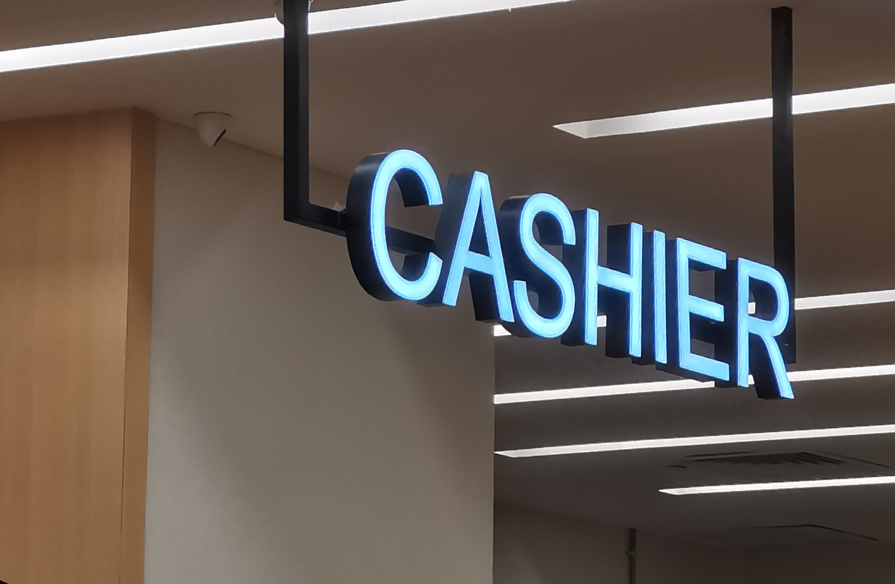 A neon sign reading "CASHIER" is seen at a casino. Playboy Casino Chip Saga Finally Ends, 3 Decades After Closing