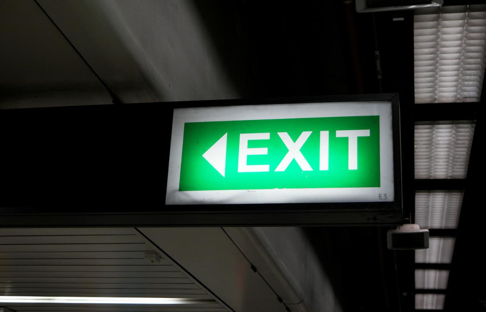 An green exit sign glows in the dark. TwinSpires Exits NJ, Ceases Online Casino & Sports Operations. CEO of Churchill Downs Incorporated (CDI) says it "received interest from numerous other groups with respect to market access" in nine states.